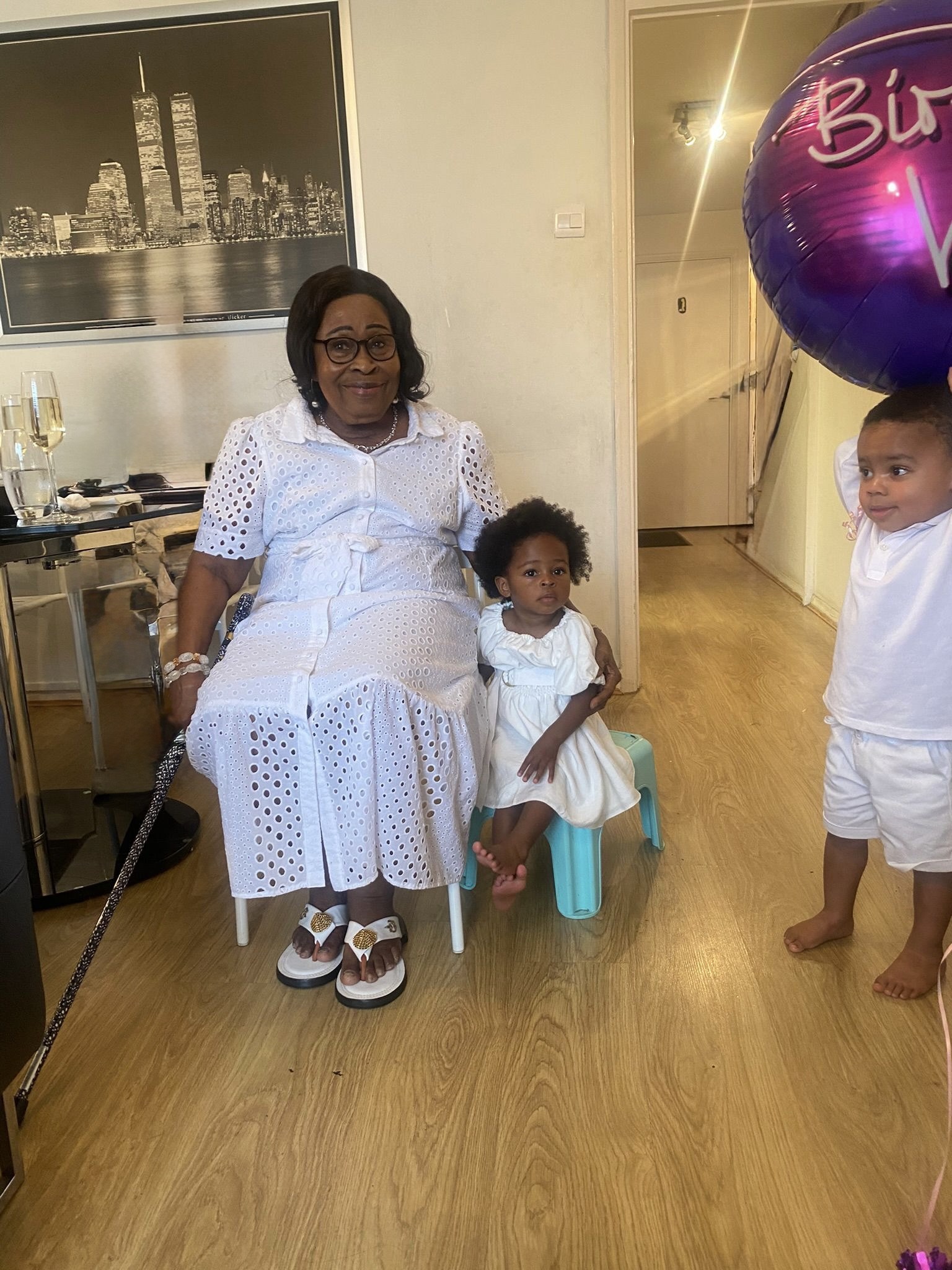With her great-grandchildren.